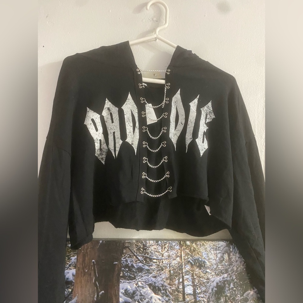 Cropped front split sweater with front split and silver chain details. Size L.